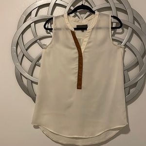 Cream sleeveless top.